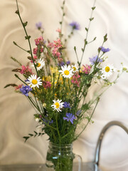 Bouquet of wildflowers in a glass vase.