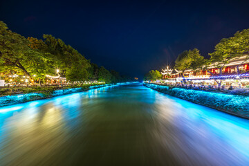 Minjiang River illuminated at night in Dujiangyan, China