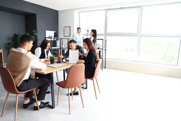 Business people negotiating at table in conference hall