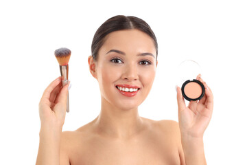 Young Asian woman with makeup brush and powder on white background, closeup