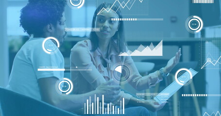 Image of financial data processing over diverse colleagues discussing work in office