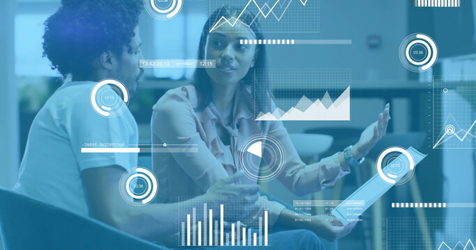 Image of financial data processing over diverse colleagues discussing work in office