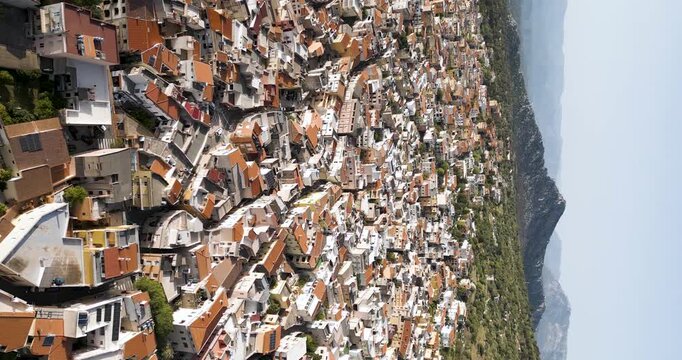 Vertical View Of Colorful Houses Of Cala Gonone Town In Dorgali, Sardinia, Italy. Aerial Shot