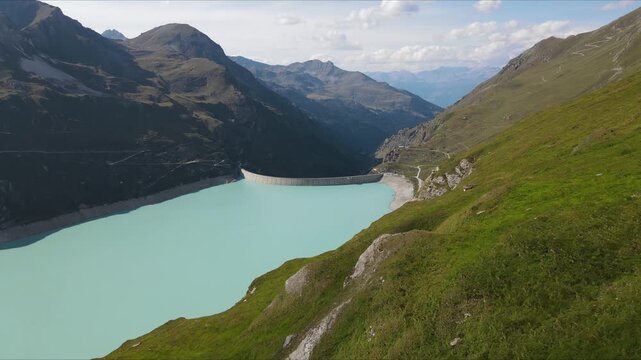 Aerial footage of Moiry Dam in Switzerland, showcasing the stunning turquoise reservoir surrounded by the majestic Swiss Alps. Moiry Dam, Switzerland, Schweiz.