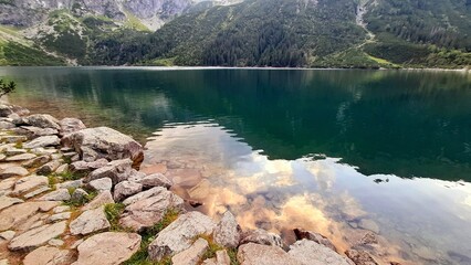 View of lake Morskie Oko in Tatra mountains on cloudy day, Zakopane, Poland © Olena Shvets