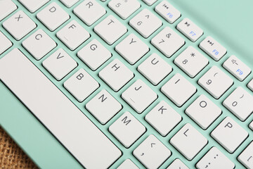 Modern cyan computer keyboard, closeup