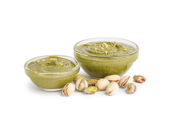 Tasty pistachio paste in bowls on white background