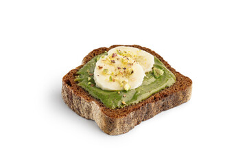 Piece of bread with tasty pistachio paste and banana slices on white background