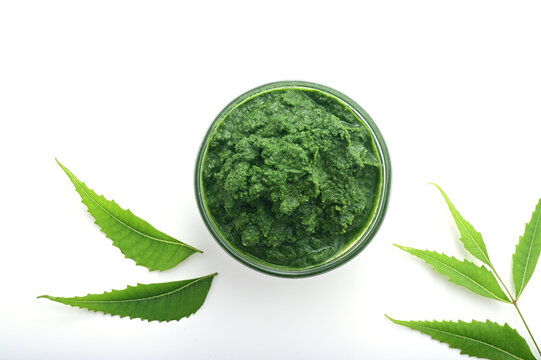 NEEM PASTE ON ROUND SHAPE BOWL ON WHITE BACKGROUND.