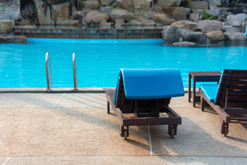 There are sun loungers by the pool