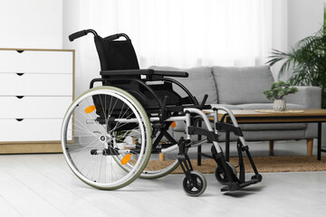 Empty wheelchair in living room
