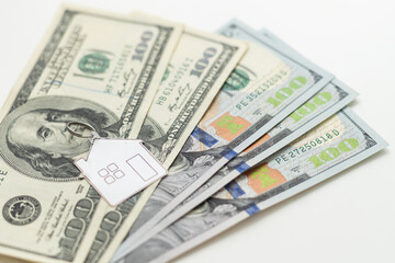 house layout and dollar bills on the background