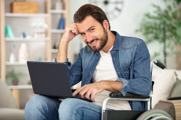 disabled person in the wheelchair works in the office