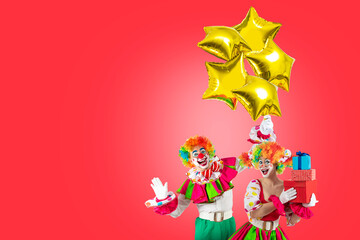 Funny clowns with balloons and gifts, entertainers in a suit and wig, with clown whiteface makeup. Trickster, jester, pantomime, mime, professional actors for parties and events