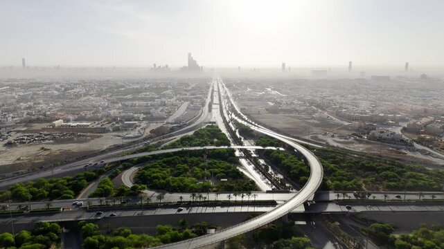 Drone view of busy complex road junction in the hazed mornig Saudi Arabia Riyadh