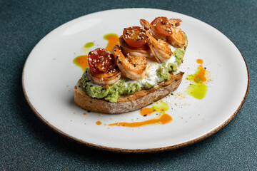 Delicious bruschetta with shrimp, cheese and herbs