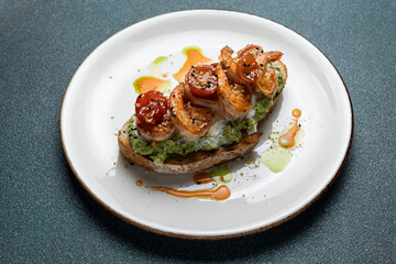 Delicious bruschetta with shrimp, cheese and herbs