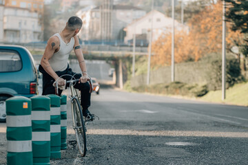 urban young man riding a bicycle