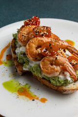 Delicious bruschetta with shrimp, cheese and herbs