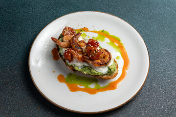 Delicious bruschetta with shrimp, cheese and herbs