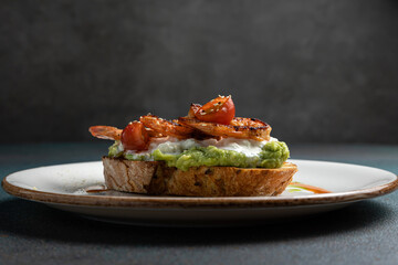 Delicious bruschetta with shrimp, cheese and herbs