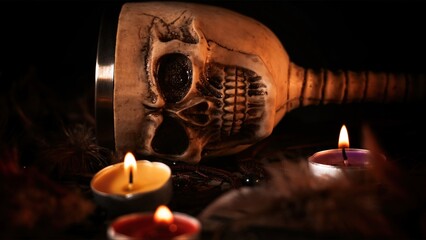 Creepy Skull on a Witchcraft Ouija Board and Candles
