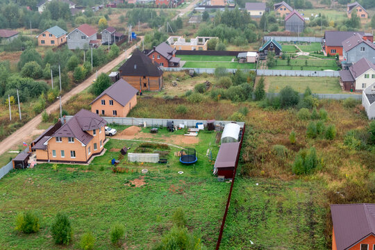 Top view of a holiday village in the Moscow region on a summer foggy morning
