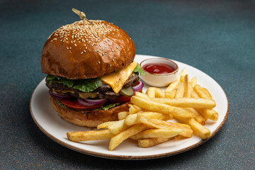 A delicious hamburger on a dark background.