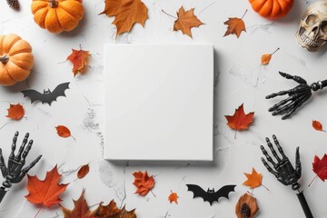 Obraz premium a white blank frame in the center. Autumn background with pumpkin and leaves around