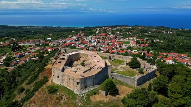 Frankish Castle And Museum Overlooking The Village Of Chlemoutsi In The Peloponnese, Southern Greece. Aerial Shot