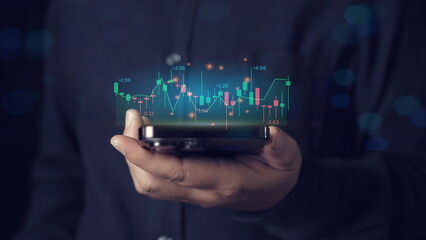smartphone. Financial stock market.Businessmen investor think before buying stock market investment using smartphone to analyze trading data.