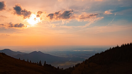 Alpine sunset or sundowner with Lake Simssee in the background at Mount Kampenwand, Aschau, Chiemgau, Rosenheim, Bavaria, Germany
