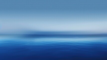 Obraz premium A gradient blue background that transitions from a deep navy at the top to a light sky blue at the bottom, creating a soothing and tranquil effect. 
