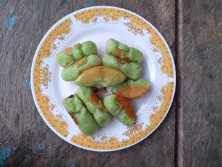 Kue Pukis, Traditional Javanese half-moon shaped pancakes. made from flour eggs yeast and coconut milk.on white background