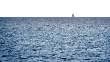 Lone small sailboat far away at the straight horizon at the edge of the sea