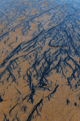 Braided pattern on the sand surface.
