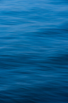 Serene blue water textures captured at twilight