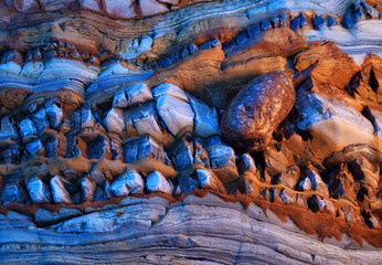 Intricate coastal cliff formations in warm tones