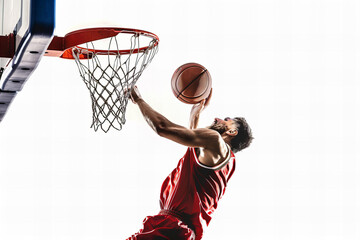 Naklejka premium Basketball player making slam dunk isolated on white background.