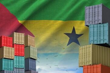 Sao Tome and Principe flag and big stack of shipping cargo containers in docks with sky background...