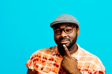 Man with finger on chin, thinking, looking at camera