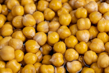 chickpeas porridge with honey during cooking