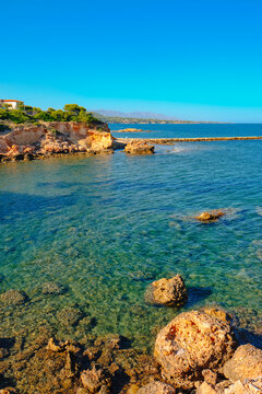 clear seawater at La Buena beach in El Perello, Spain