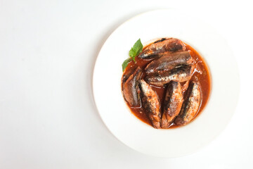 plate of canned sardines isolated on white background
