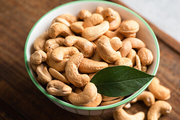 Roasted cashew nuts in a bowl, closeup view