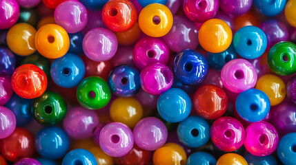 Background pattern featuring a vibrant assortment of multicolored beads, creating a rich and colorful palette.