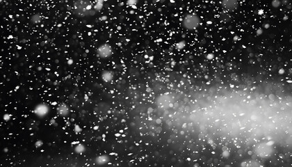 Obraz premium White snow falling down on black background
