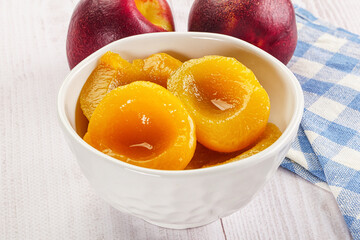 Canned peaches with sweet syrope