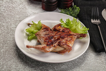 Grilled quail in the plate
