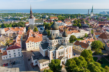 Aerial view of Alexander Nevsky Cathedral in Tallinn Old Town on a sunny summer morning. St. Mary's Cathedral, defensive walls, rooftops.